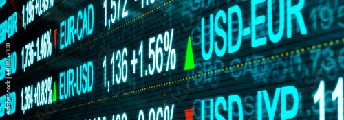 Forex trading. Close-up currency rates and symbols from USD, EUR, GBP, JPY or AUD on a trading monitor with slightly defocus at the edges. Currency and exchange rates concept. 3D illustration	 photo