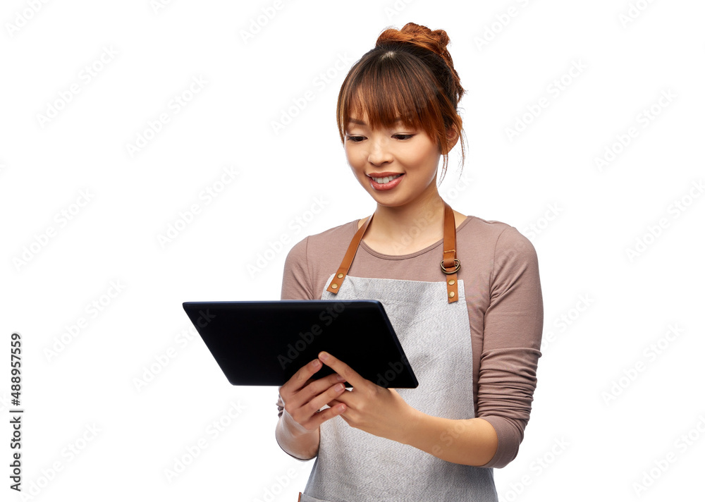 cooking, technology and people concept - happy smiling female chef or waitress in apron with tablet pc computer over white background cooking, technology and people concept - happy smiling female chef or waitress in apron with tablet pc computer over white background