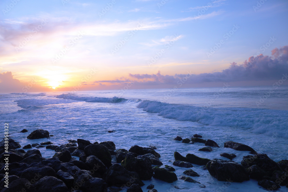 beautiful waves and clouds on the ocean shore 