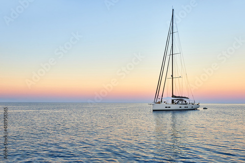 Sailing yacht at sunset in the sea. Travel and yachting © Alvov