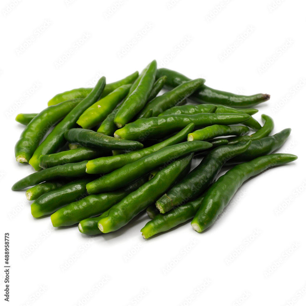 A pile of green chili pepper without stalk chili pole on white background. spot focus. A pile of green chili pepper without stalk chili pole on white background. spot focus.