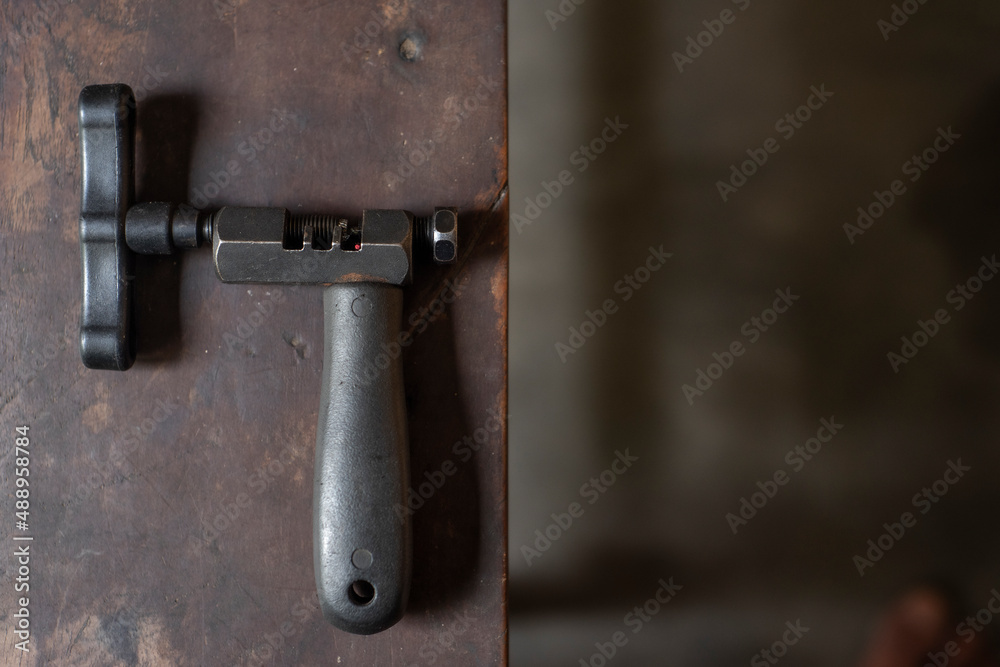 Bicycle tools on the wooden table with negative space for words Bicycle tools on the wooden table with negative space for words