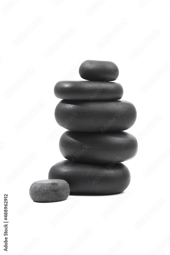 black spa stones isolated on white background . black spa stones isolated on white background .