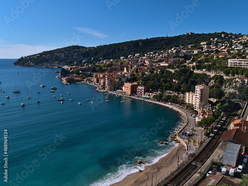 Beautiful view over small town Villefranche-sur-Mer at the French Riviera on the coast of the mediterranean sea on sunny day in autumn season.