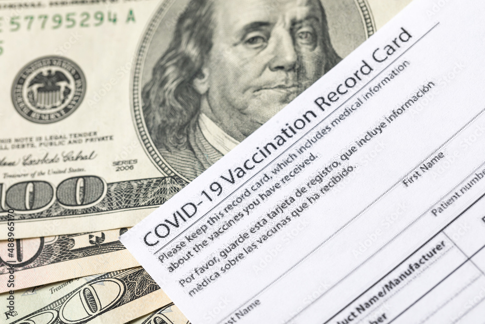 Covid-19 vaccination card and cash money - Image Covid-19 vaccination card and cash money - Image