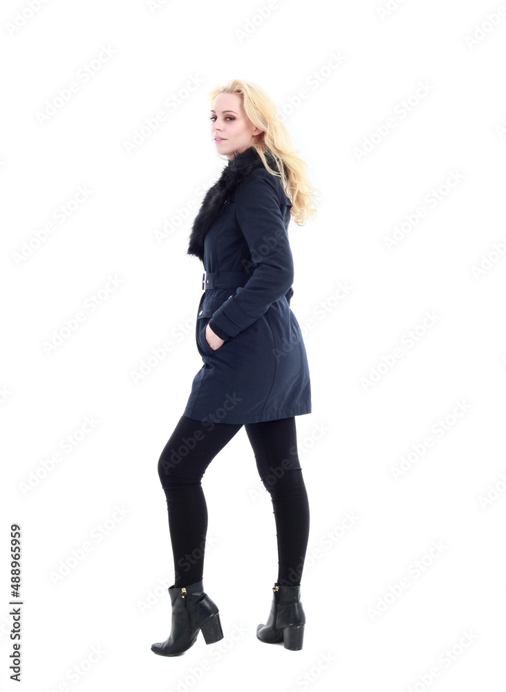 full length portrait of blonde woman wearing long winter coat. and casual clothes. standing pose, isolated on a white studio background. full length portrait of blonde woman wearing long winter coat. and casual clothes. standing pose, isolated on a white studio background.