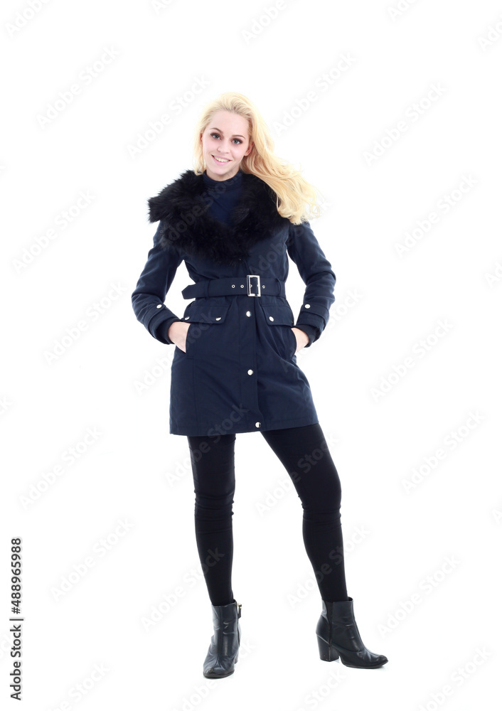 full length portrait of blonde woman wearing long winter coat. and casual clothes. standing pose, isolated on a white studio background. full length portrait of blonde woman wearing long winter coat. and casual clothes. standing pose, isolated on a white studio background.