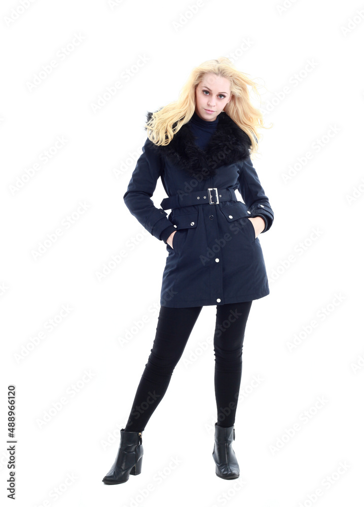 full length portrait of blonde woman wearing long winter coat. and casual clothes. standing pose, isolated on a white studio background. full length portrait of blonde woman wearing long winter coat. and casual clothes. standing pose, isolated on a white studio background.