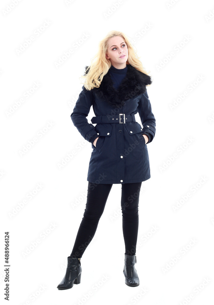 full length portrait of blonde woman wearing long winter coat. and casual clothes. standing pose, isolated on a white studio background. full length portrait of blonde woman wearing long winter coat. and casual clothes. standing pose, isolated on a white studio background.