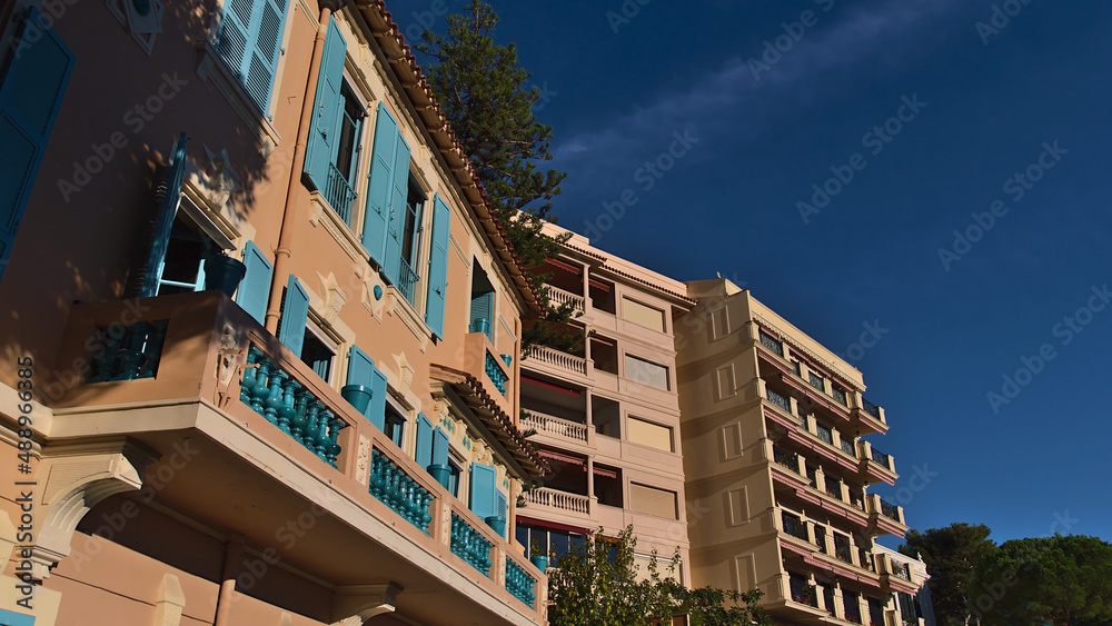 Low angle view of residential apartments buildings located in district Monaco-Ville, Principality of Monaco in the afternoon sunlight with clear sky.