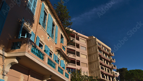 Low angle view of residential apartments buildings located in district Monaco-Ville, Principality of Monaco in the afternoon sunlight with clear sky. photo