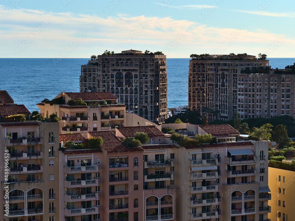 Beautiful cityscape of Monaco at the French Riviera with mediterranean sea and luxury residential high-rise buildings of district Fontvieille.