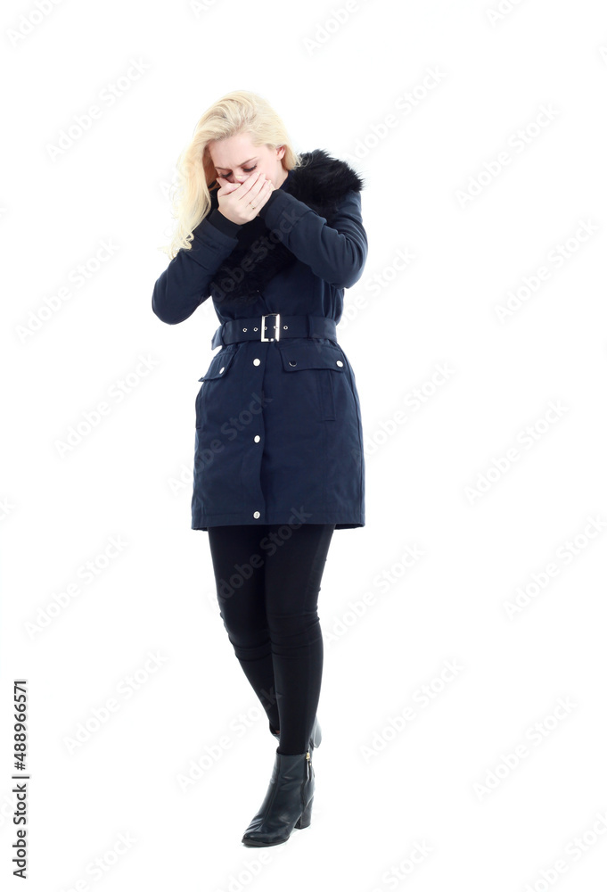 full length portrait of blonde woman wearing long winter coat. and casual clothes. standing pose, isolated on a white studio background. full length portrait of blonde woman wearing long winter coat. and casual clothes. standing pose, isolated on a white studio background.