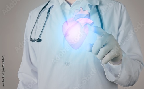 Obraz na plátně Young doctor touchstone virtual Heart in hand
