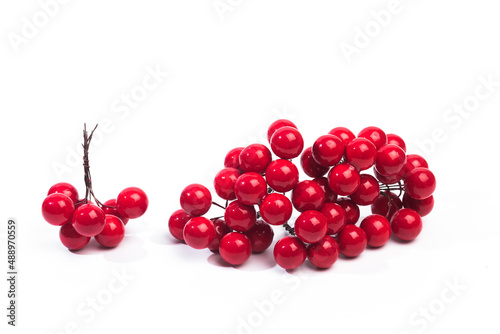 .christmas decoration red berries in bunches isolated on white background .