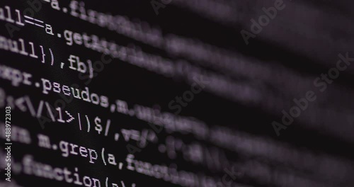 4K Close up shot programming tag code on PC Monitor scroll down. Background concept for programming and coding web development.