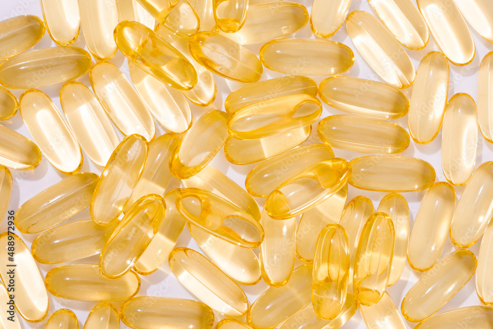 Close up of oil filled capsules suitable for: fish oil, omega 3, omega 6, omega 9, vitamin A, vitamin D, vitamin D3, vitamin E - Image Close up of oil filled capsules suitable for: fish oil, omega 3, omega 6, omega 9, vitamin A, vitamin D, vitamin D3, vitamin E - Image