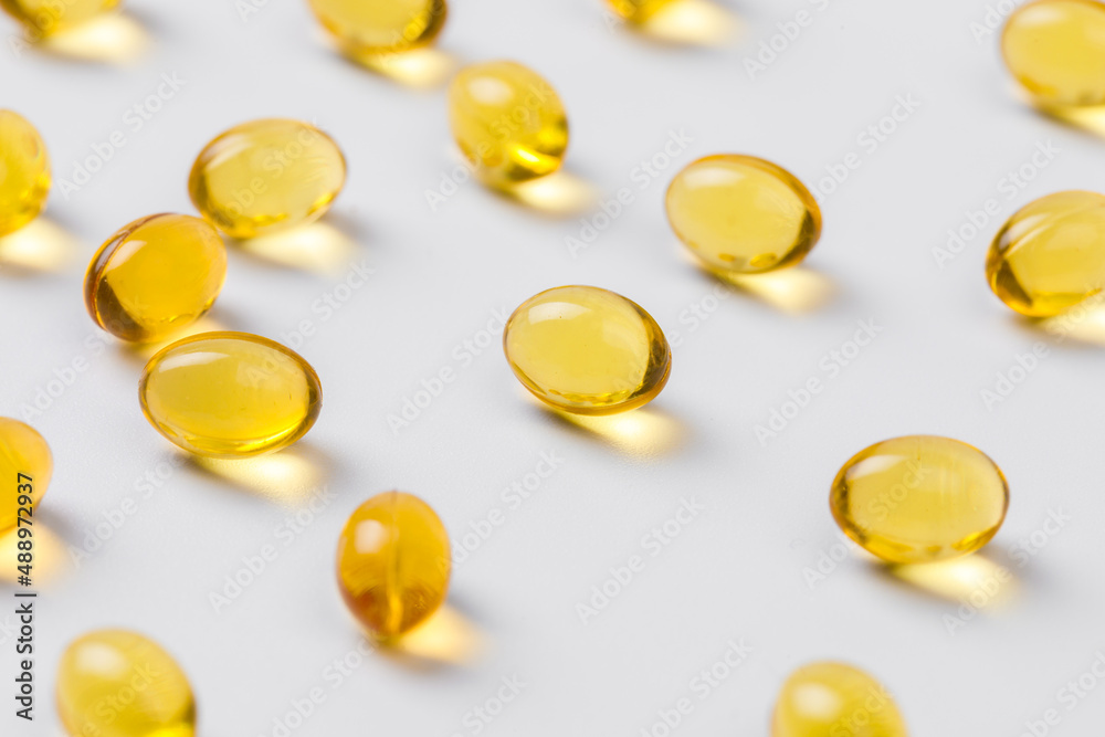 Close up of oil filled capsules suitable for: fish oil, omega 3, omega 6, omega 9, vitamin A, vitamin D, vitamin D3, vitamin E - Image Close up of oil filled capsules suitable for: fish oil, omega 3, omega 6, omega 9, vitamin A, vitamin D, vitamin D3, vitamin E - Image