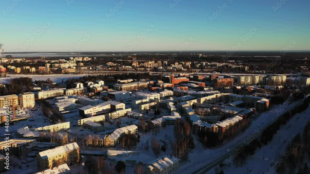 Aerial view of Myllytuuli district, golden hour in Oulu city - tracking, drone shot Aerial view of Myllytuuli district, golden hour in Oulu city - tracking, drone shot
