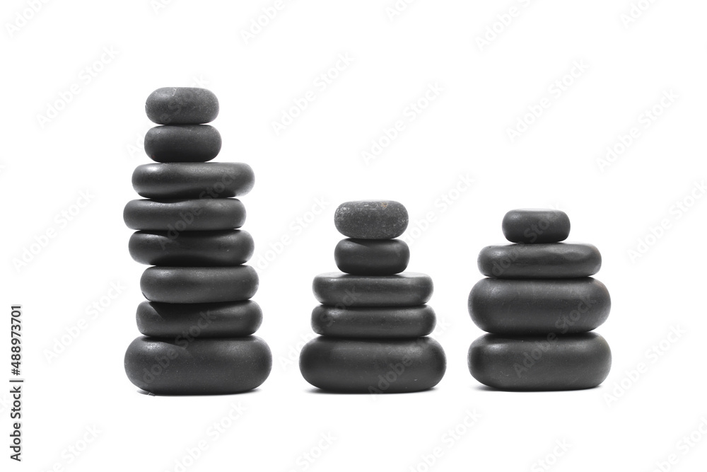 black spa stones isolated on white background . black spa stones isolated on white background .