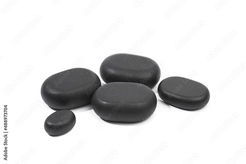 black spa stones isolated on white background . black spa stones isolated on white background .