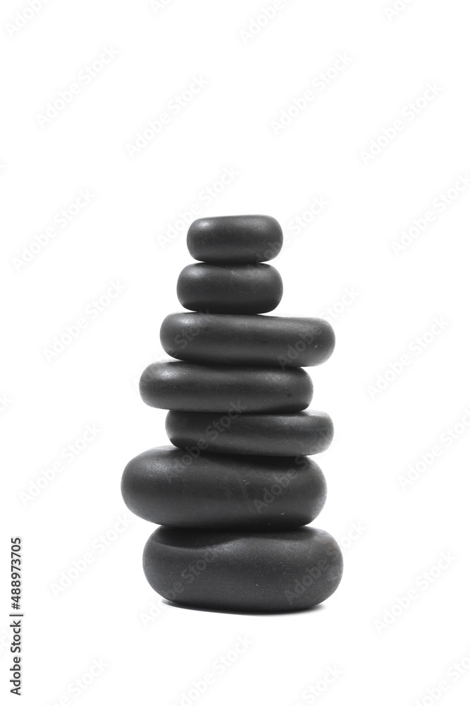 black spa stones isolated on white background . black spa stones isolated on white background .