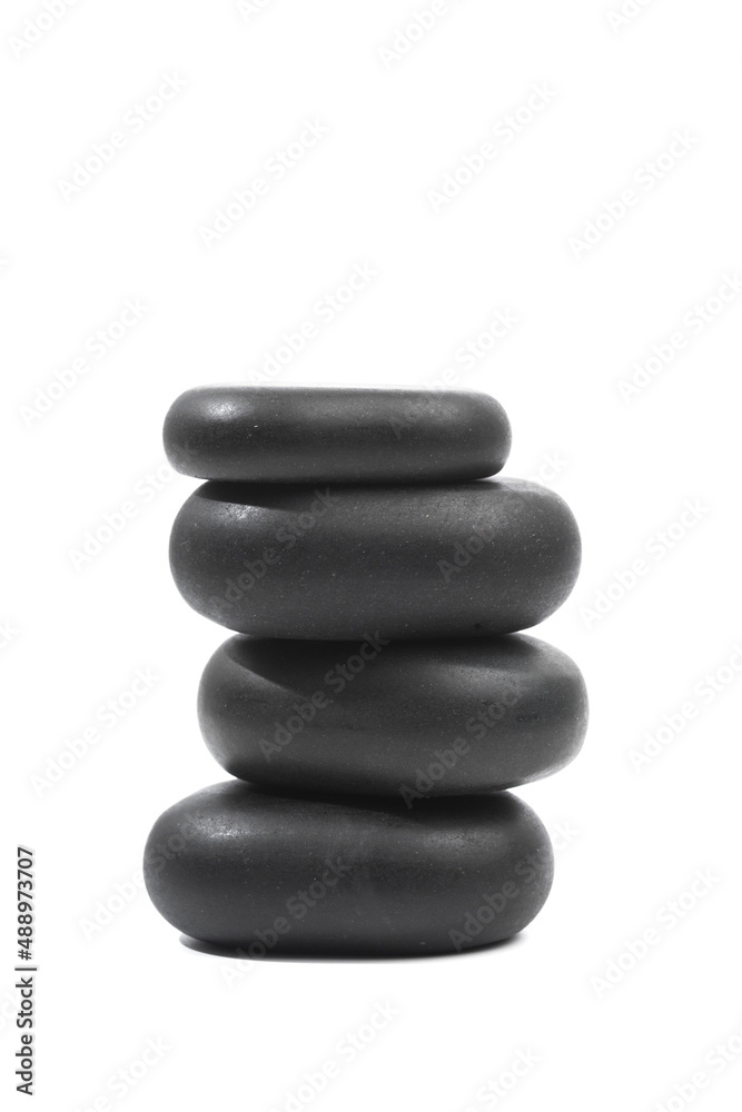 black spa stones isolated on white background . black spa stones isolated on white background .