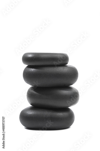 black spa stones isolated on white background .