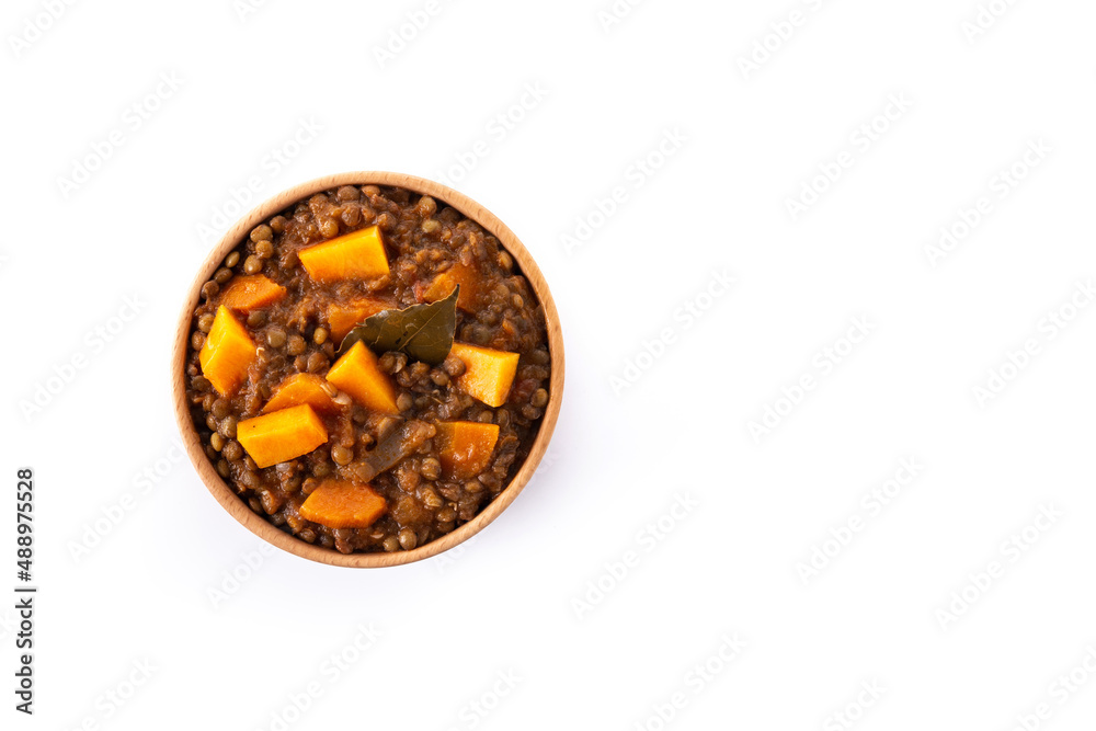 Lentil stew ragout with pumpkin and carrot in bowl isolated on white background. Top view. Copy space Lentil stew ragout with pumpkin and carrot in bowl isolated on white background. Top view. Copy space