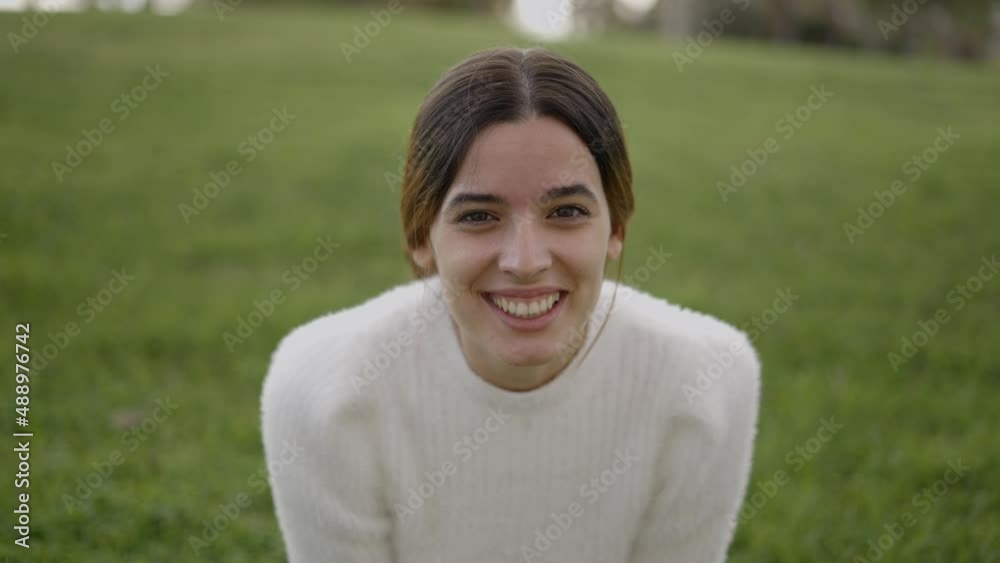 Close view of young brunette smiling and making sad expression Close view of young brunette smiling and making sad expression