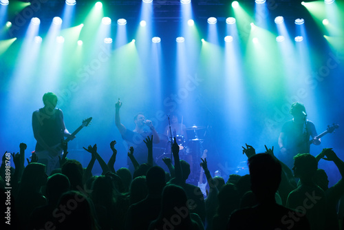 Shot of a large crowd at a music concert- This concert was created for the sole purpose of this photo shoot  featuring 300 models and 3 live bands. All people in this shoot are model released