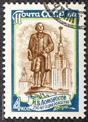 RUSSIA - CIRCA 1961: Stamp printed in USSR Russia , shows monument to Russian scientist Mikhail Lomonosov 1711-1765 in front of Moscow University, circa 1961 photo