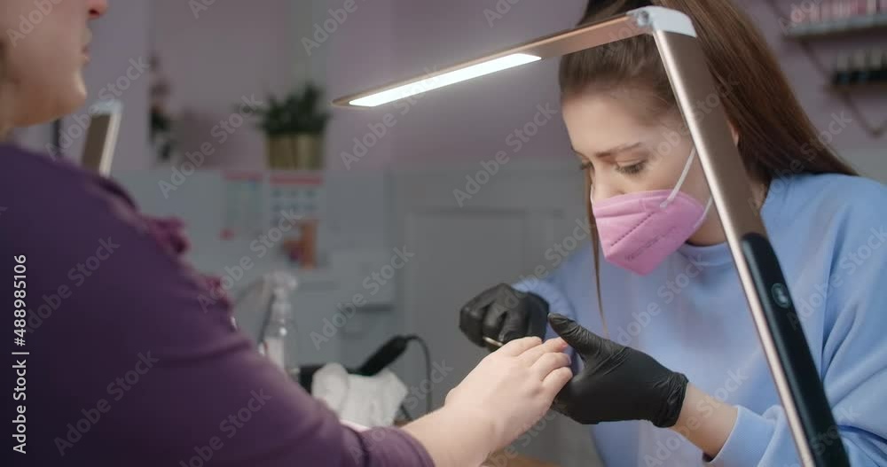 Cosmetologist manicurist does procedure of the cropp manicure, beauty salon procedures, 4k Prores 60p Cosmetologist manicurist does procedure of the cropp manicure, beauty salon procedures, 4k Prores 60p