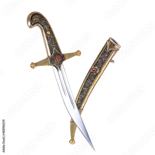 A fantasy long sword, with a skull and gold on isolated white background. 