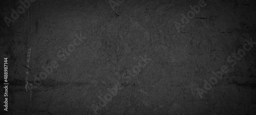 Black anthracite dark gray grey grunge old aged retro vintage stone concrete cement blackboard chalkboard wall floor texture, with cracks - Abstract background banner panorama pattern design template