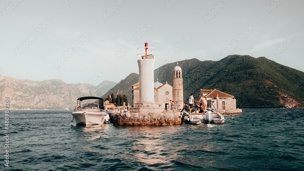 Our Lady of the Rocks is an artificial island created by bulwark of rocks and by sinking old and seized ships loaded with rocks. Beautiful place in the bay of Kotor.