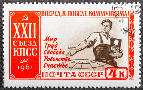 USSR - CIRCA 1961: Postage stamp of the Soviet Union showing a Communist man that offers peace, work, liberty, equality and happiness. 22nd Congress of the Communist Party of the Soviet Union, circa