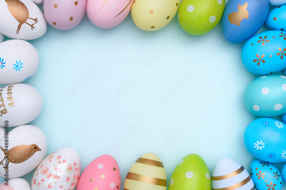 Colorful Frame of Easter eggs. Many decorative painted Easter eggs are arranged by color. Easter eggs Gradient with copy space.