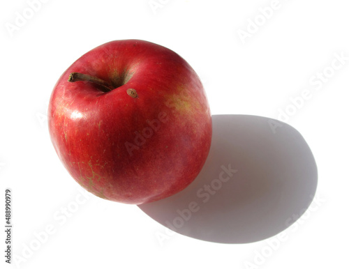 Apple on a white background. sunlight