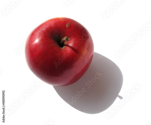Apple on a white background. sunlight