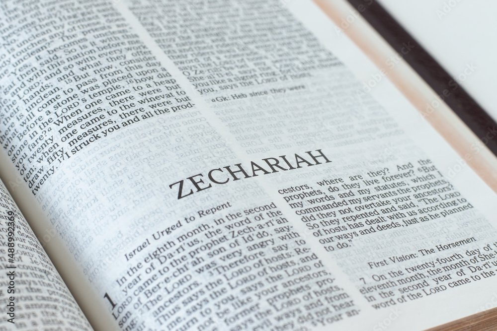 Zechariah open Holy Bible Book close-up. Old Testament Scripture prophecy. Studying the Word of God Jesus Christ. Christian biblical concept of faith, hope, and trust. Zechariah open Holy Bible Book close-up. Old Testament Scripture prophecy. Studying the Word of God Jesus Christ. Christian biblical concept of faith, hope, and trust.