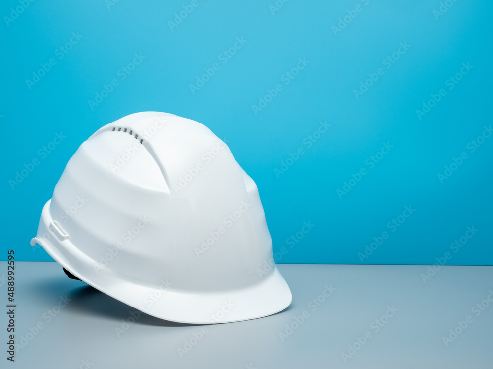 Fototapeta premium White construction helmet and construction tools.