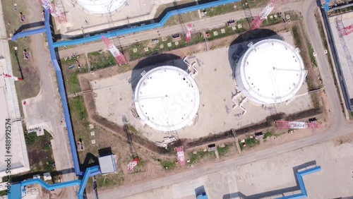 Base for storage of oil and oil products. Lots of tanks with lots of barrels of oil. Strategic object. The video was taken from a drone.