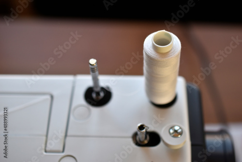New White sewing machine with threads at home