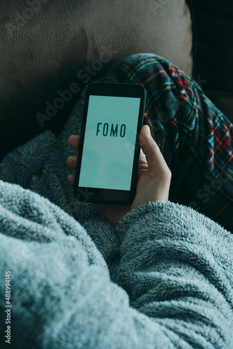 text fomo, for fear of missing out, in smartphone photo