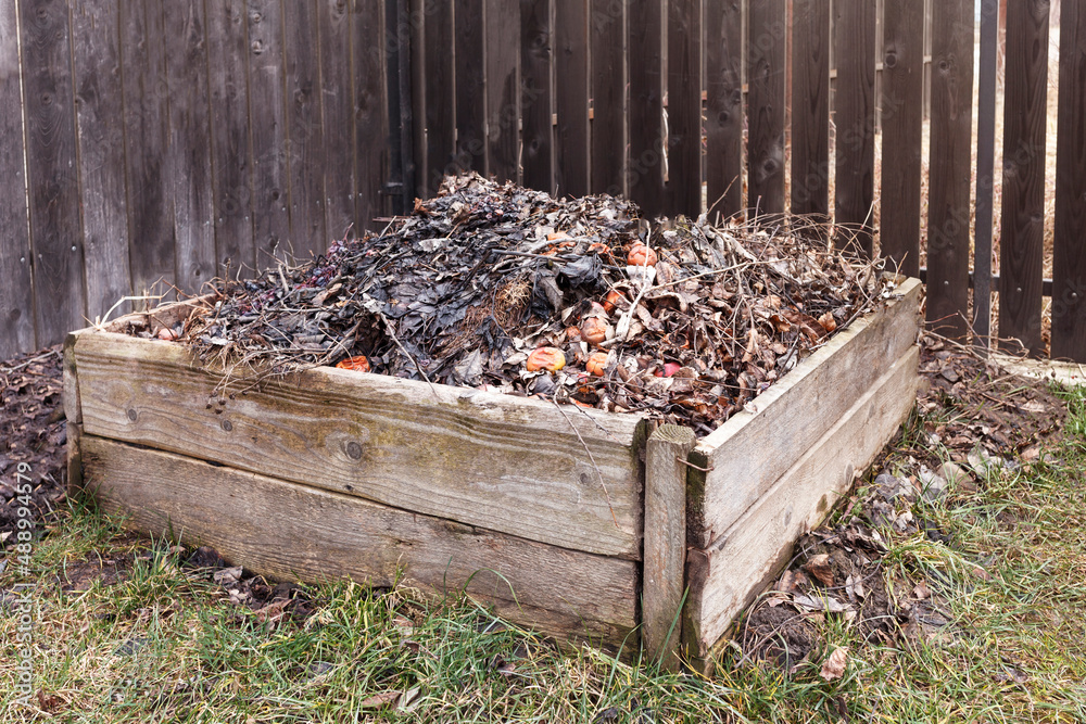 Compost Box. Humus Organic Fertilizer. Compost pile in garden. Compost Box. Humus Organic Fertilizer. Compost pile in garden.