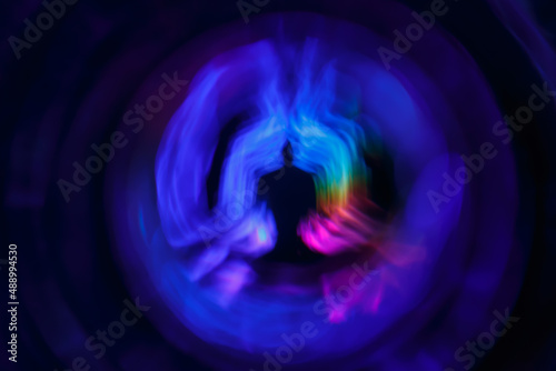 Yoga meditation in lotus pose with aura spiritual. Abstract blurred background photo