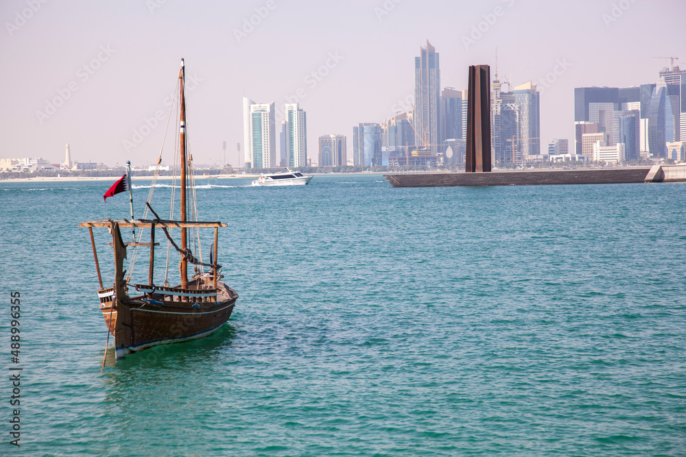
Doha,Qatar- December 23,2018 :  Traditional dhow boats with the futuristic skyline of Doha in the background.