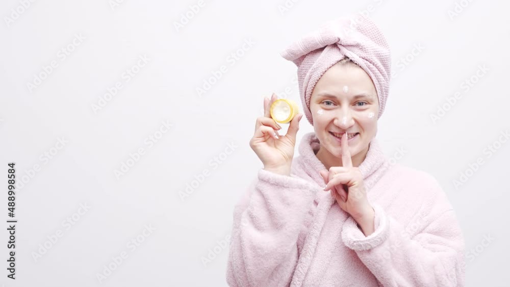 Woman With Towel On Head Holds A Jar Of Cosmetic Cream Healthy Woman With Towel On Head Holds A Jar Of Cosmetic Cream Healthy