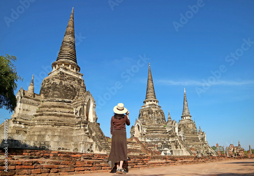 Female Tourist Visiting the Incredible Historic Pagoda Ruins of Wat Phra Si Sanphet in Ayutthaya Historical Park, Thailand